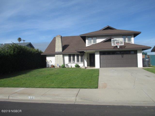233 Huntington Place Lompoc, CA 93436 - Photo 1 of 7 a front view of a house with a garden and yard