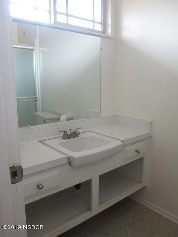 233 Huntington Place Lompoc, CA 93436 - Photo 6 of 7 a bathroom with a sink and a mirror