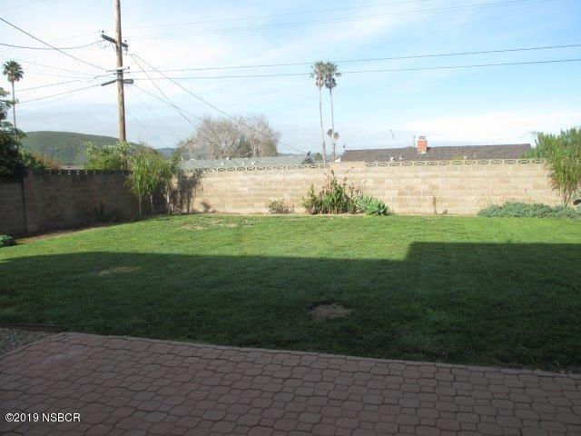233 Huntington Place Lompoc, CA 93436 - Photo 7 of 7 a view of a ocean with a big yard and palm trees