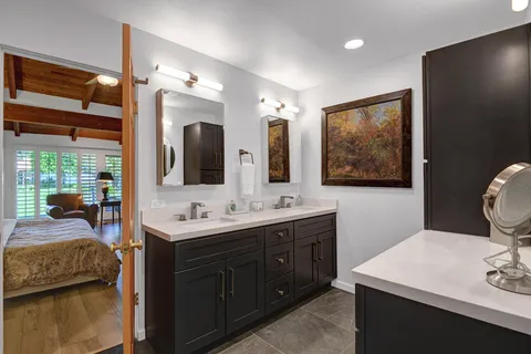 a bedroom with a bed and a dresser