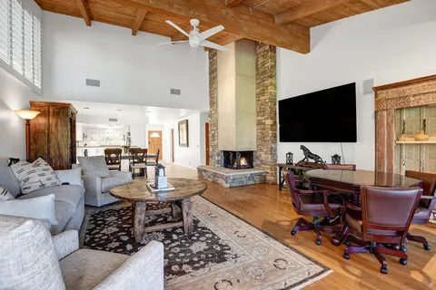 a living room with furniture and a flat screen tv
