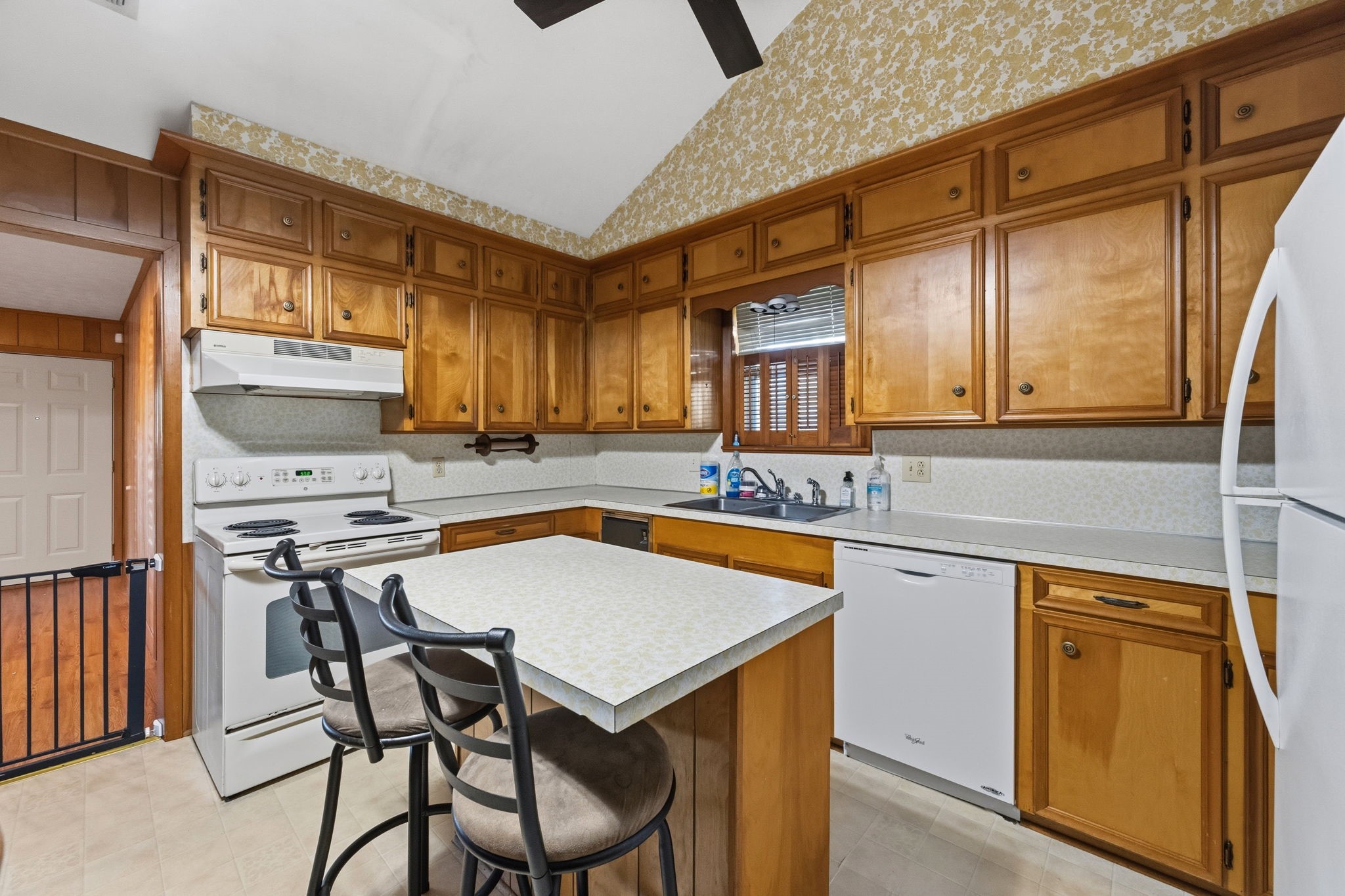 804 North Cleveland Street Dayton, TX 77535 - Photo 13 of 29 a kitchen with stainless steel appliances a sink a stove and a refrigerator