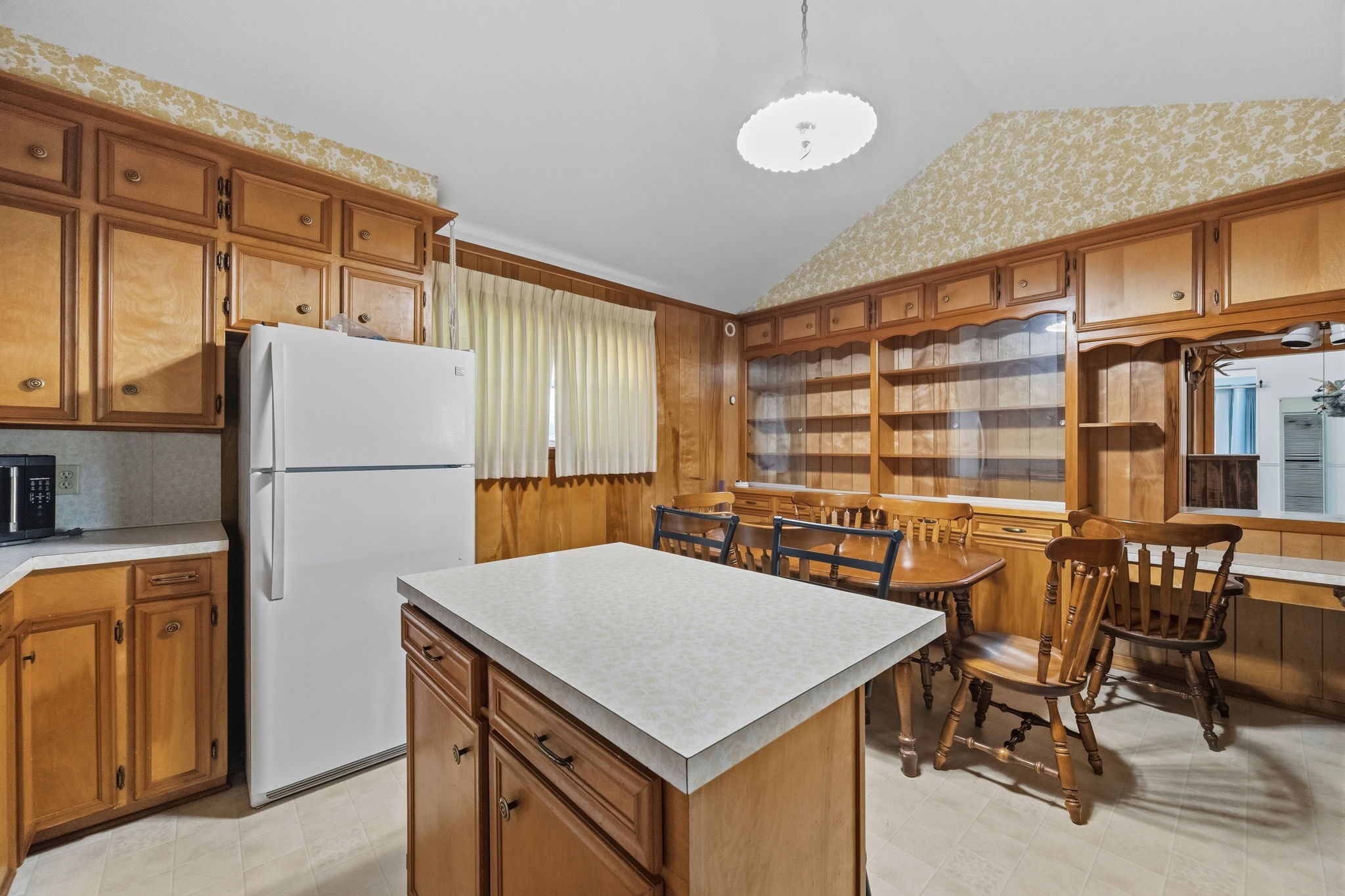 804 North Cleveland Street Dayton, TX 77535 - Photo 14 of 29 a kitchen with a table chairs and refrigerator