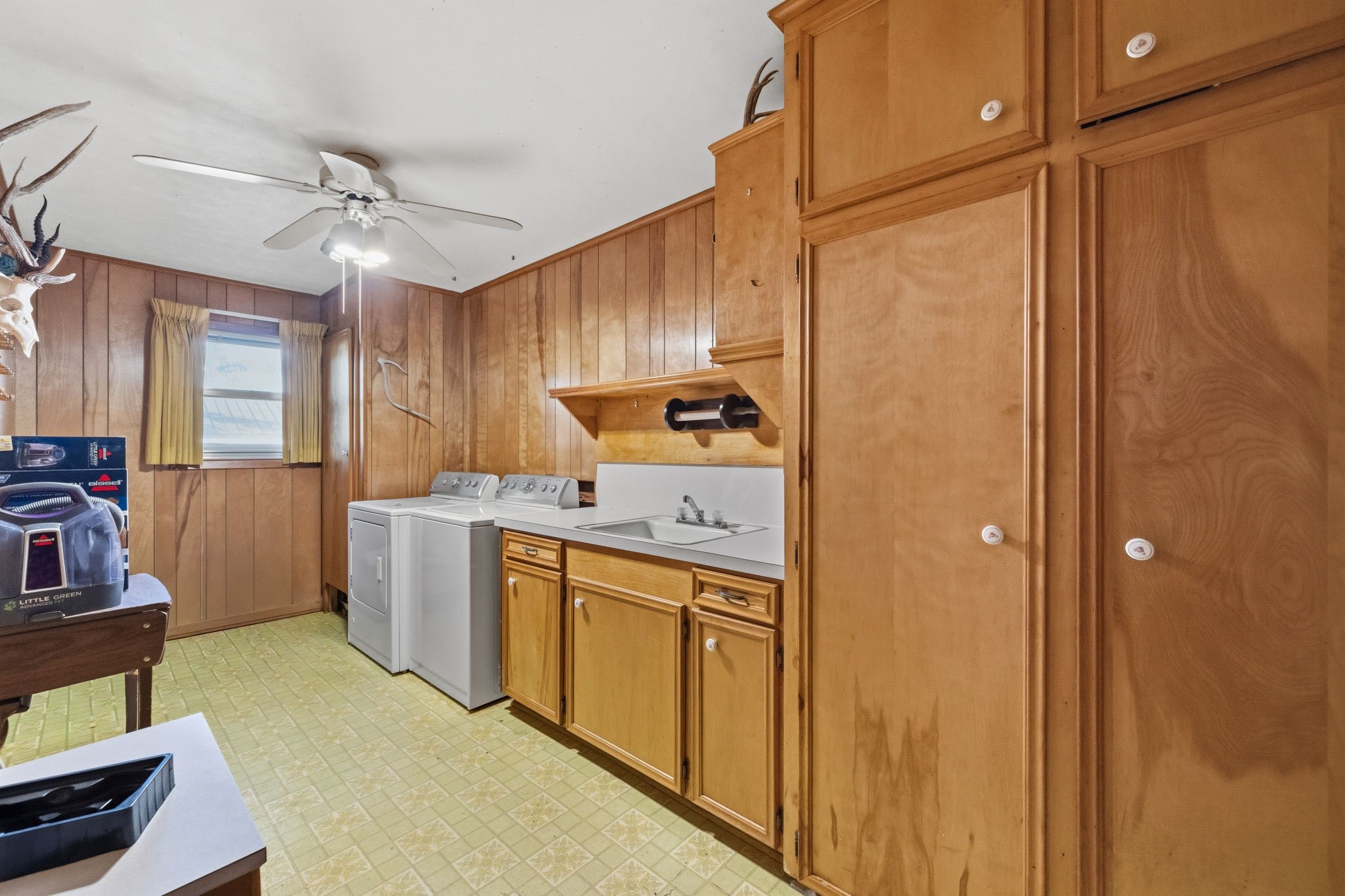 804 North Cleveland Street Dayton, TX 77535 - Photo 16 of 29 a kitchen with a refrigerator and a sink