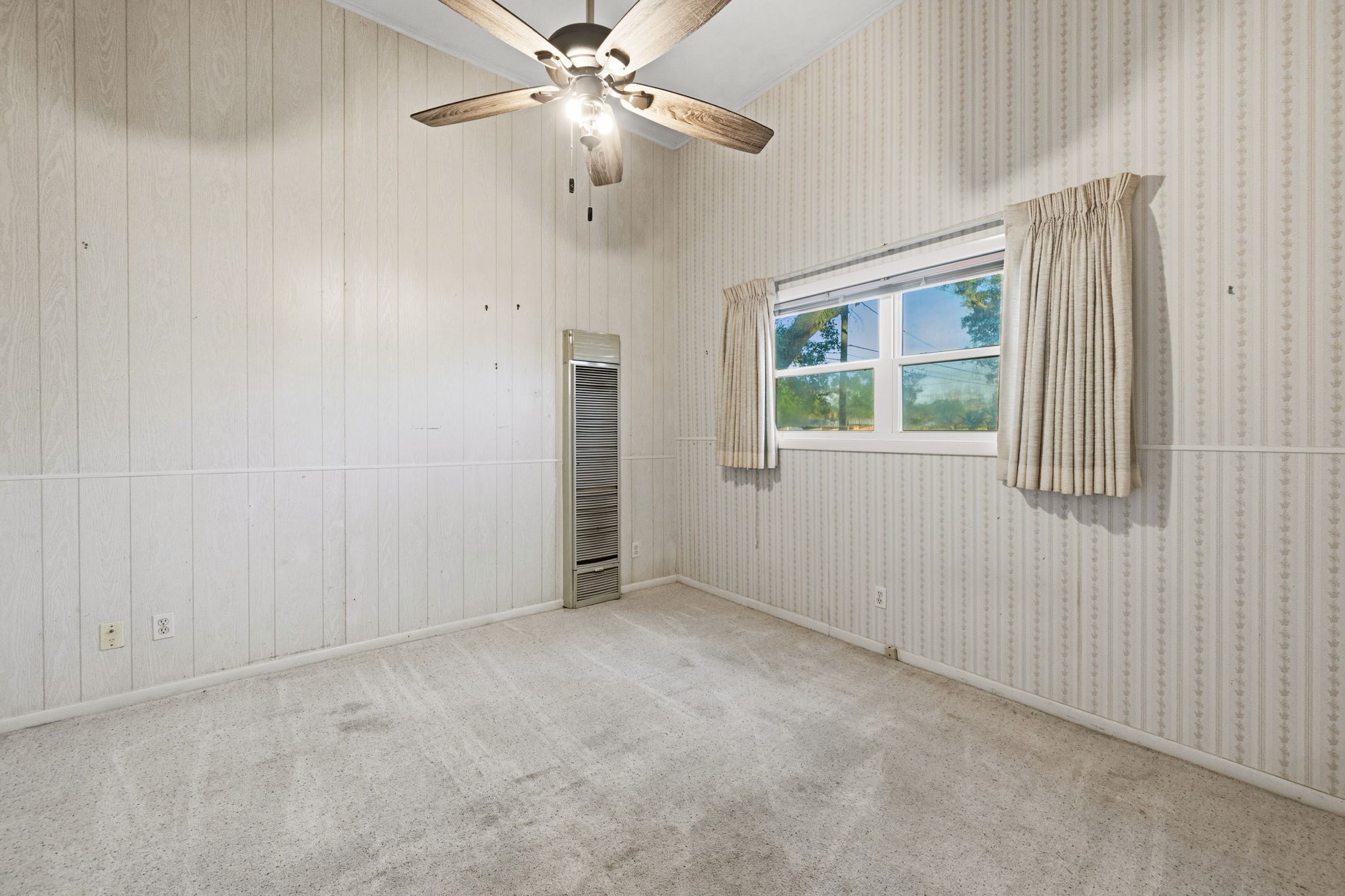 804 North Cleveland Street Dayton, TX 77535 - Photo 17 of 29 an empty room with windows and fan