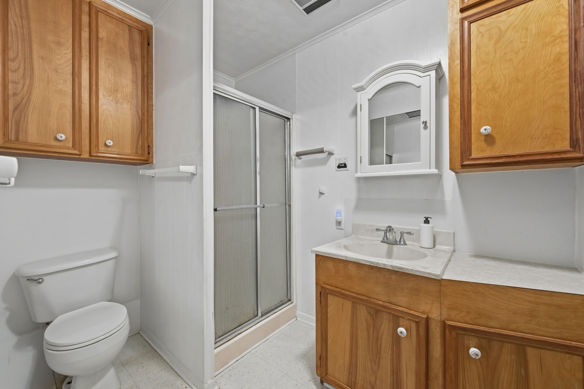 804 North Cleveland Street Dayton, TX 77535 - Photo 25 of 29 a bathroom with a sink a toilet and shower