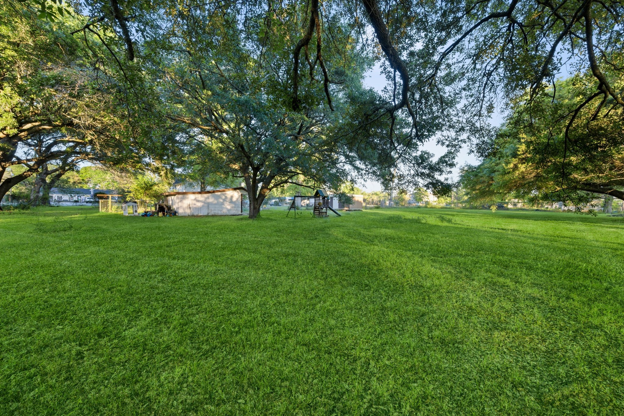 804 North Cleveland Street Dayton, TX 77535 - Photo 28 of 29 a view of grassy field with benches