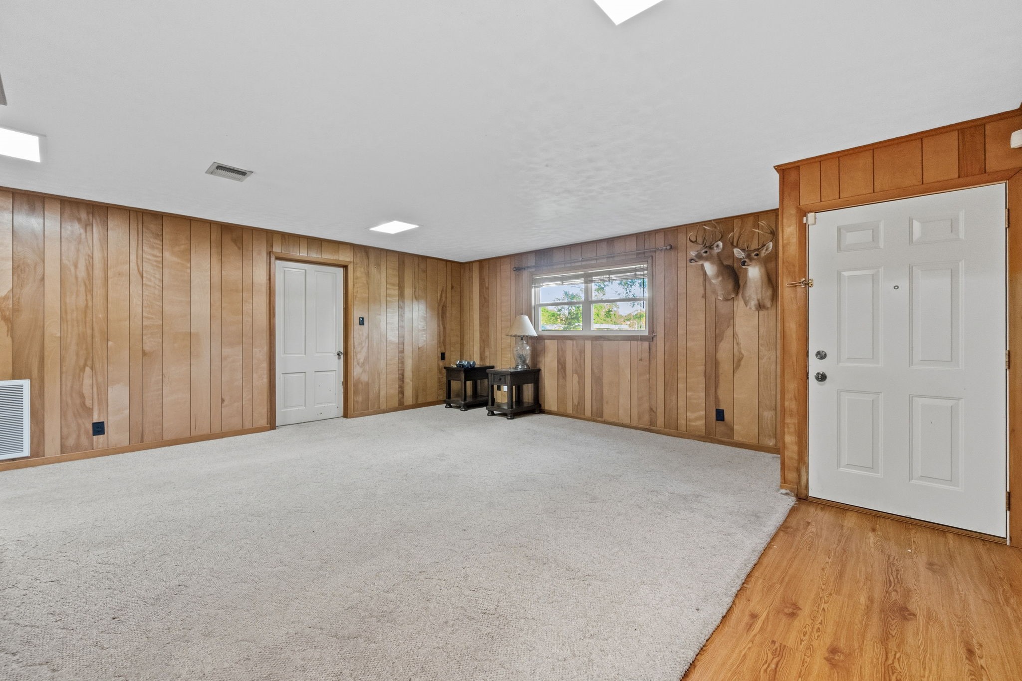 804 North Cleveland Street Dayton, TX 77535 - Photo 10 of 29 a view of an empty room with wooden floor and windows