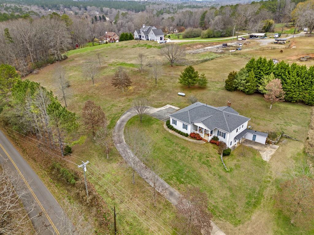 1075 Breedlove Road Ball Ground, GA 30107 - Photo 1 of 1 a aerial view of residential houses with outdoor space