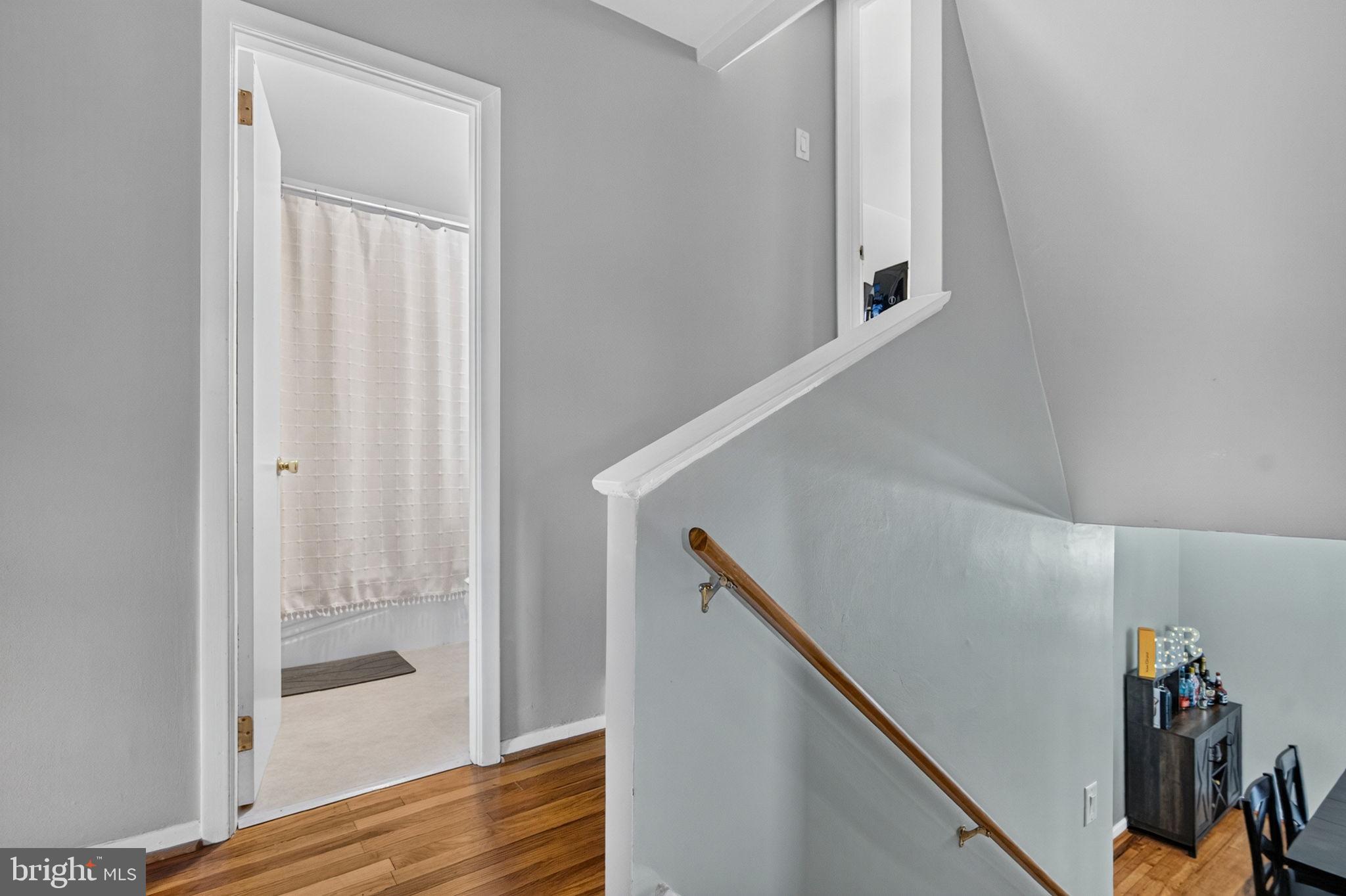 12 Woodbridge Road Gibbsboro, NJ 08026 - Photo 24 of 45 a view of hallway with stairs and wooden floor