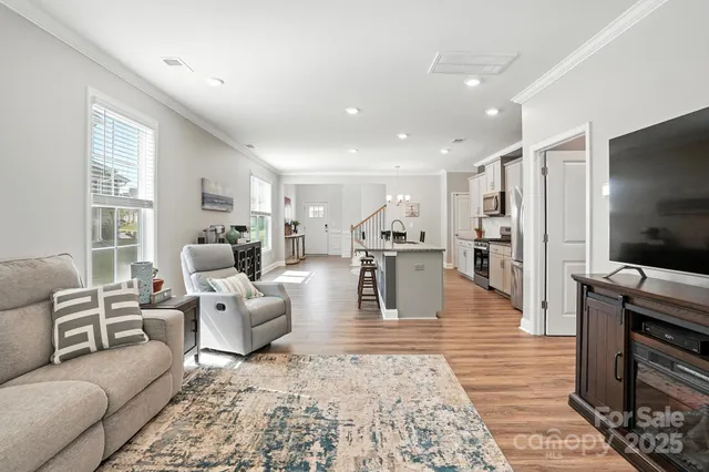 a view of a room with furniture window and wooden floor