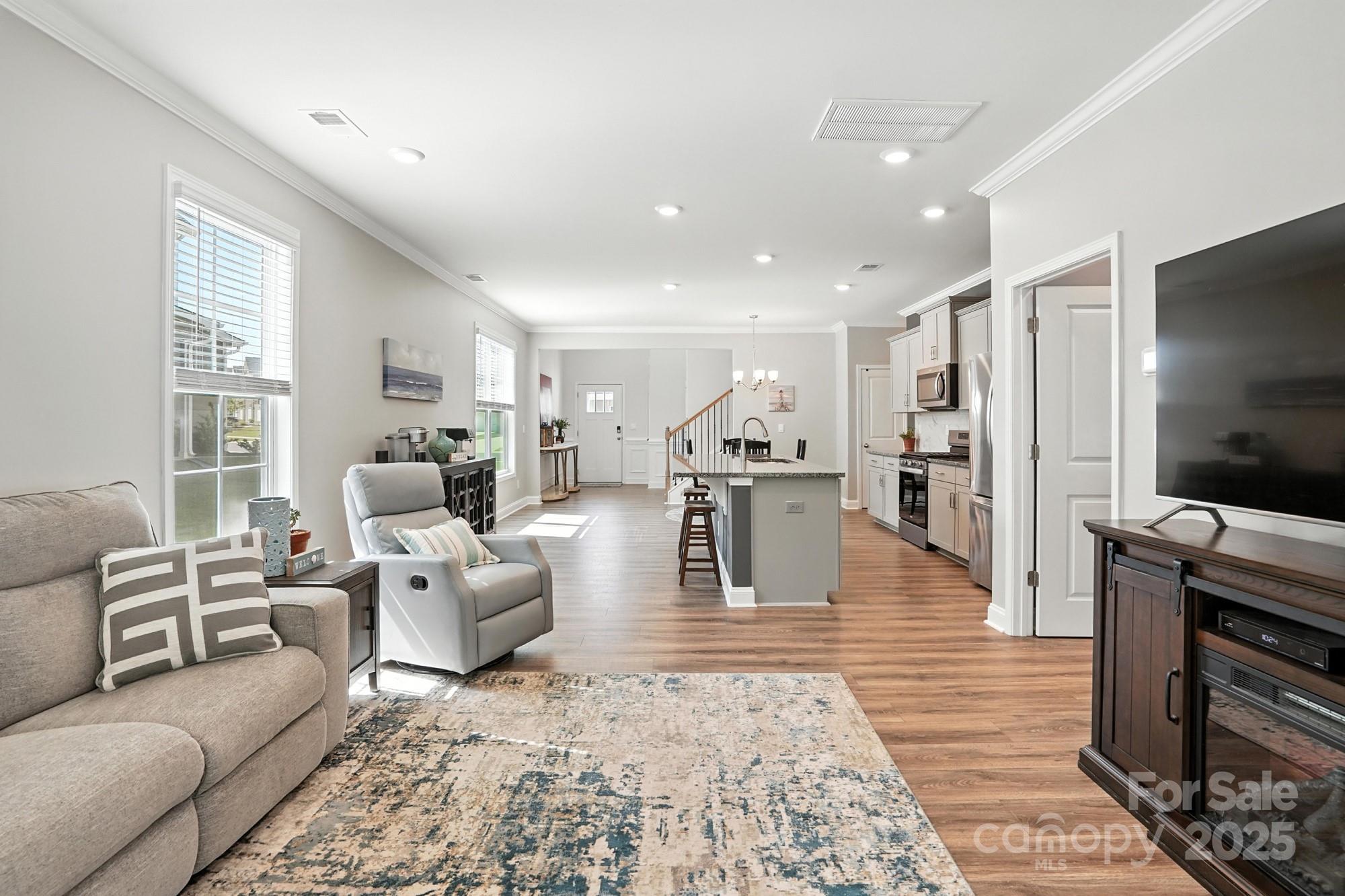 7882 Iron Road Sherrills Ford, NC 28673 - Photo 17 of 46 a living room with furniture and a flat screen tv
