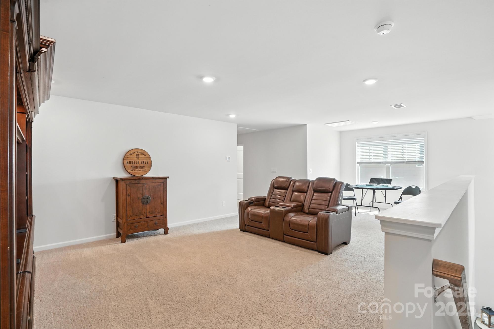 7882 Iron Road Sherrills Ford, NC 28673 - Photo 26 of 46 a living room with furniture and a flat screen tv