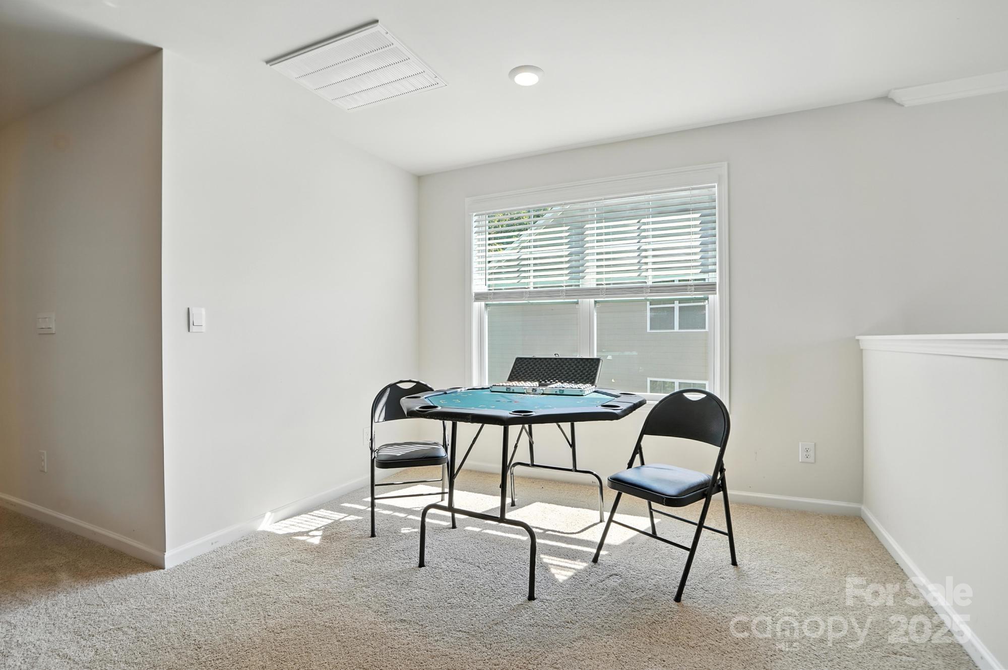 7882 Iron Road Sherrills Ford, NC 28673 - Photo 30 of 46 a view of a room with furniture window and wooden floor