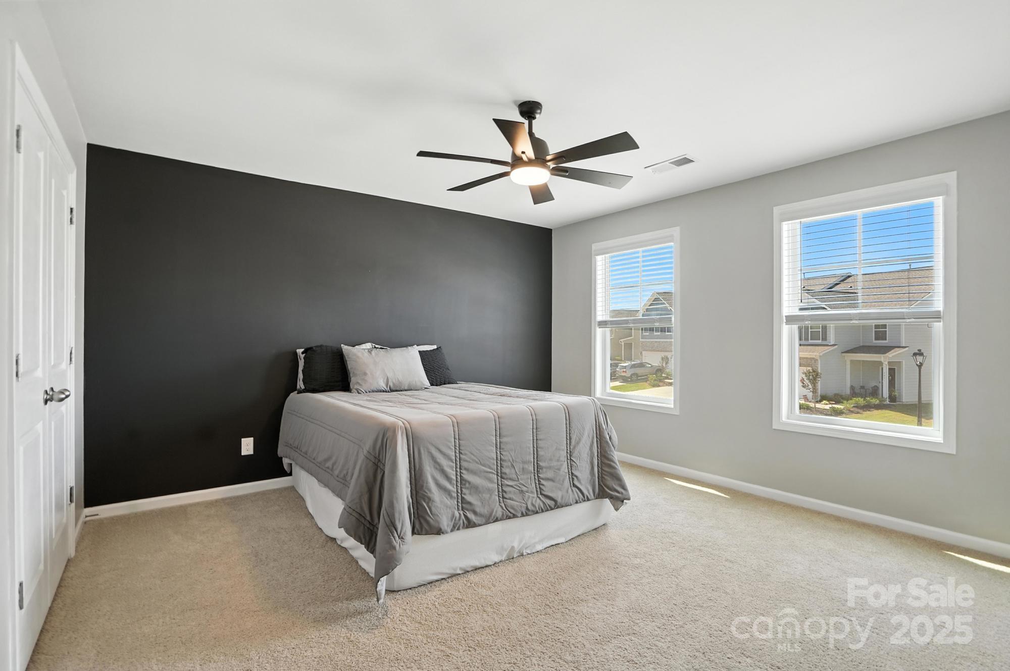 7882 Iron Road Sherrills Ford, NC 28673 - Photo 32 of 46 a spacious bedroom with a bed and a window
