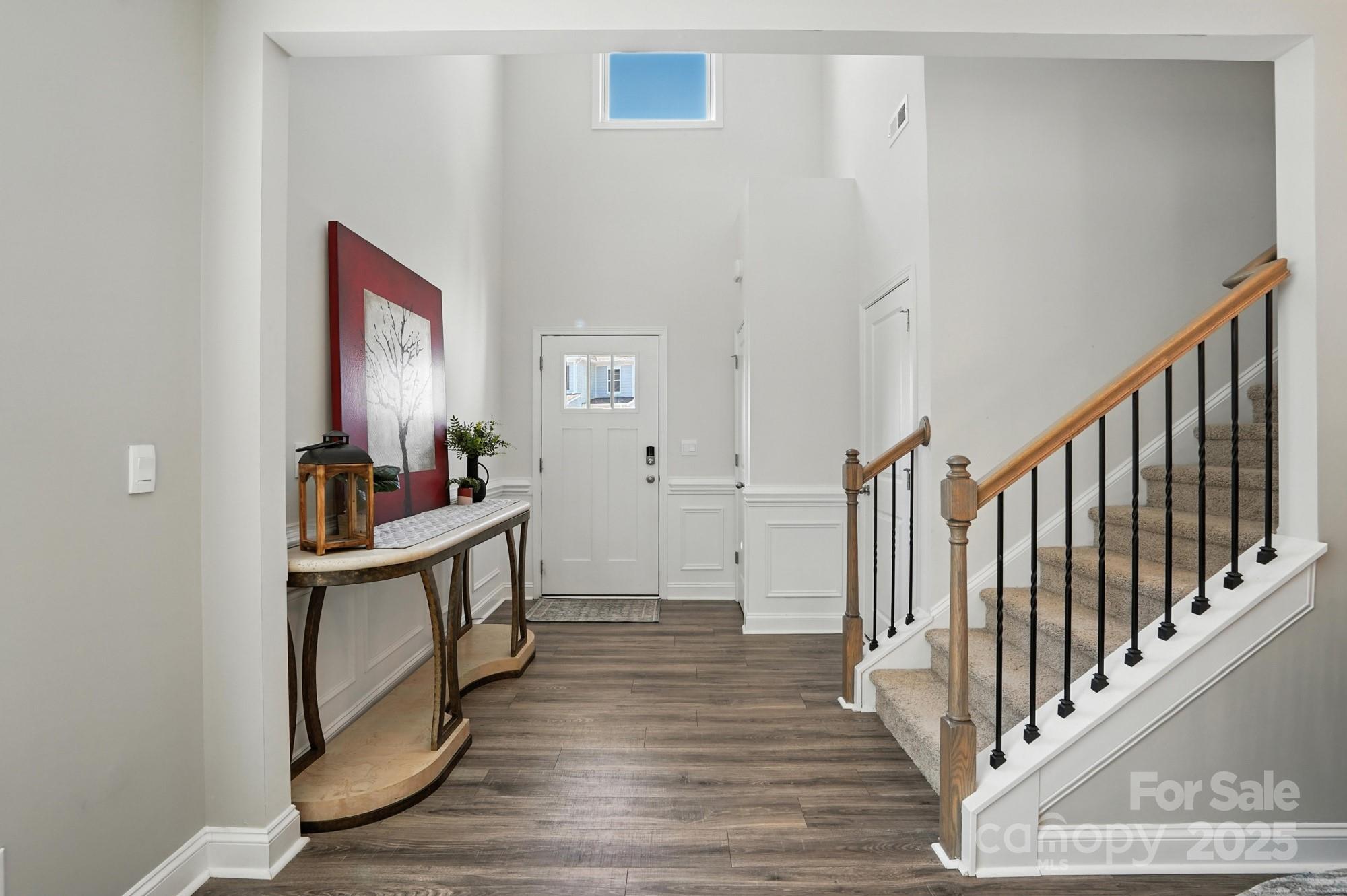 7882 Iron Road Sherrills Ford, NC 28673 - Photo 4 of 46 a view of a hallway with wooden floor and staircase