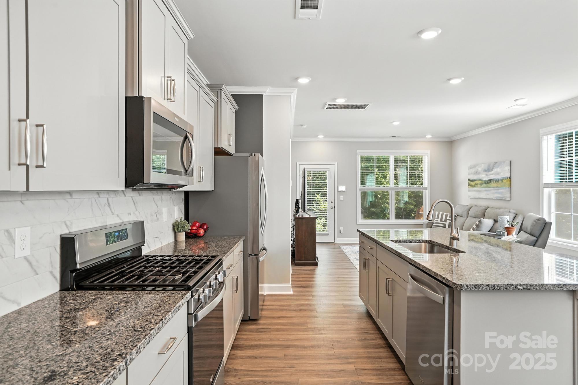7882 Iron Road Sherrills Ford, NC 28673 - Photo 10 of 46 a kitchen with stainless steel appliances granite countertop a sink stove and refrigerator