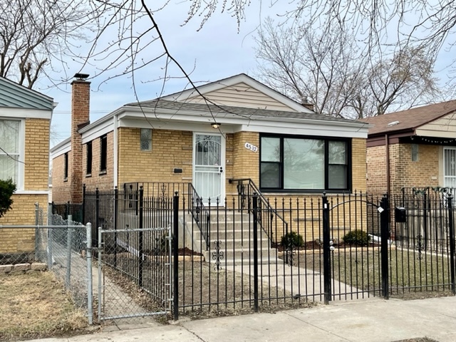 4512 South Laporte Avenue Chicago, IL 60638 - Photo 1 of 3 a front view of a house with a glass windows