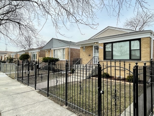 4512 South Laporte Avenue Chicago, IL 60638 - Photo 2 of 3 a front view of a house with a glass door
