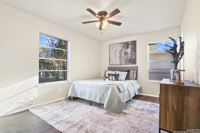 a bedroom with a large bed and a window