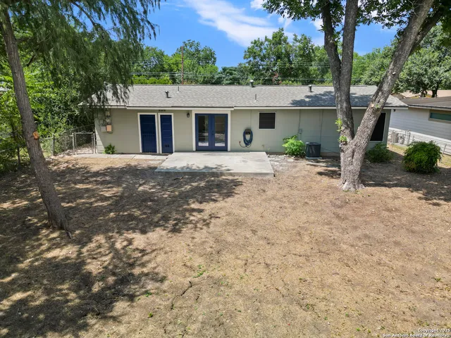 a view of a house with a yard and plants