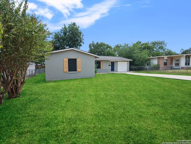 a house view with a garden space