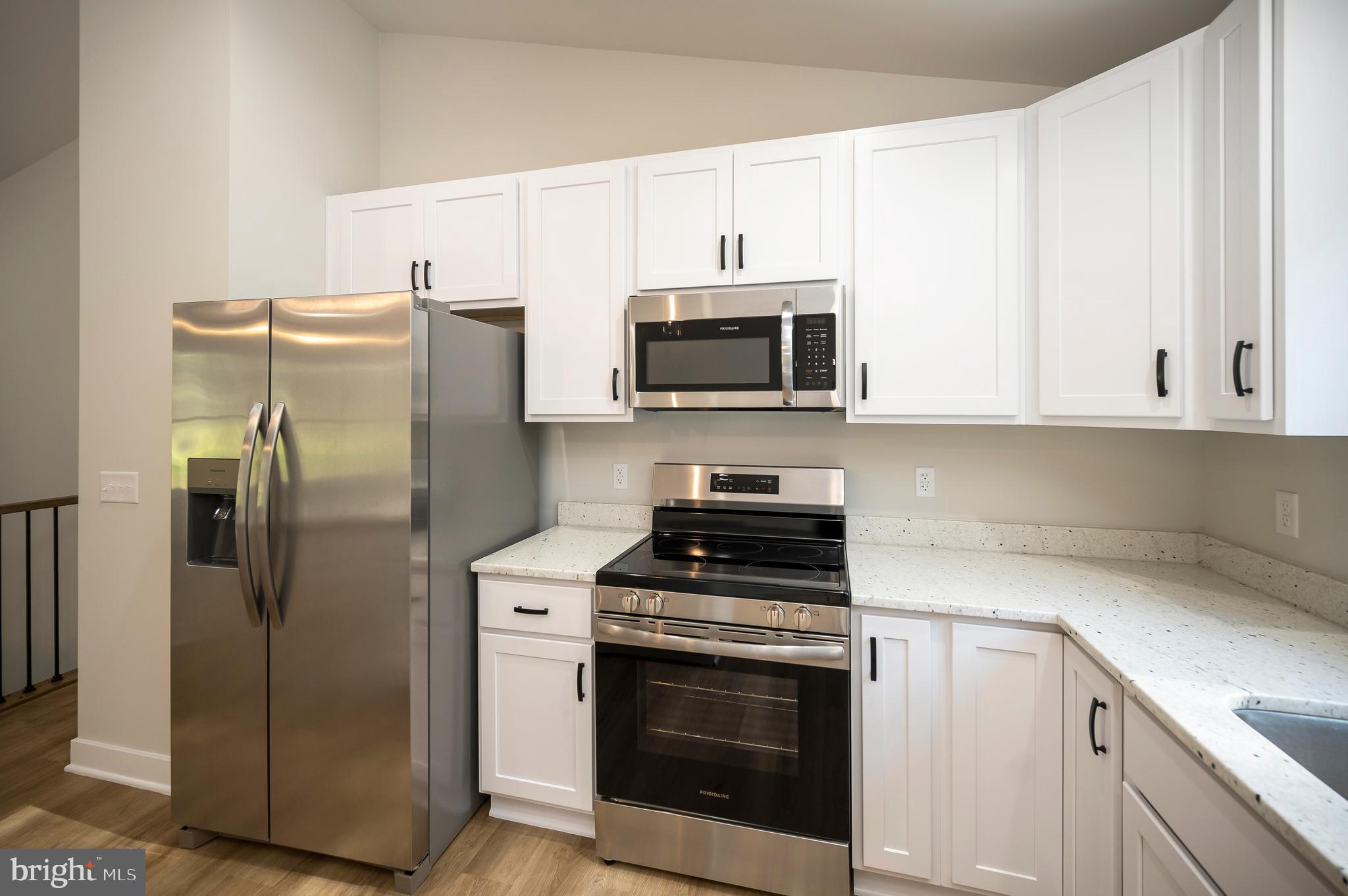3145 Lewiston Road Bumpass, VA 23024 - Photo 11 of 44 a kitchen with cabinets stainless steel appliances and a counter space