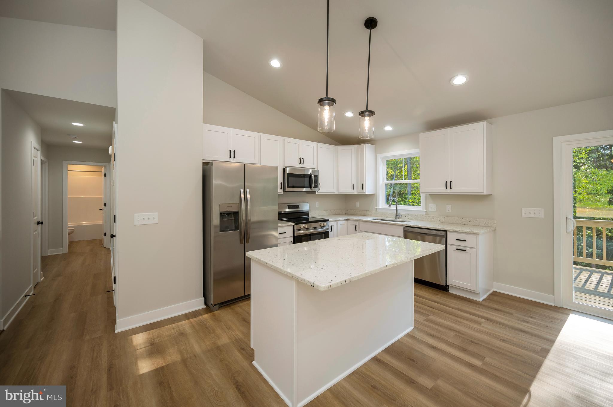 3145 Lewiston Road Bumpass, VA 23024 - Photo 13 of 44 a large kitchen with cabinets
