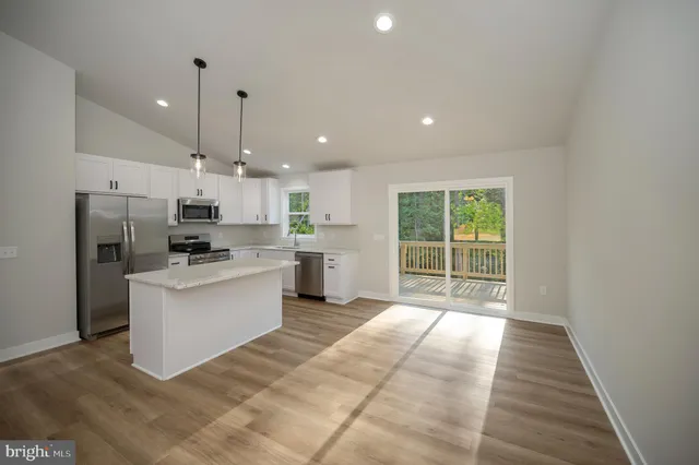 a view of balcony with wooden floor
