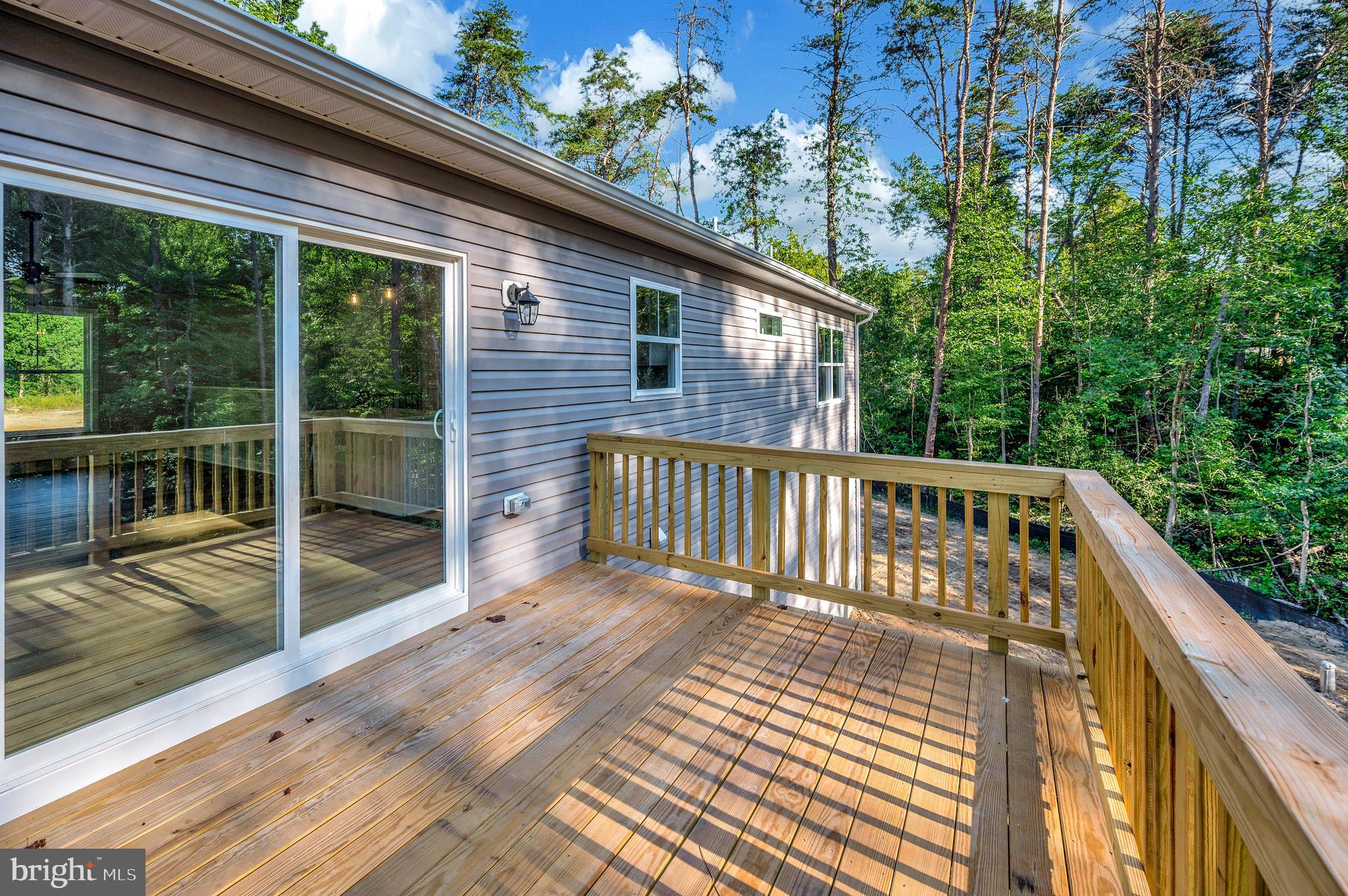 3145 Lewiston Road Bumpass, VA 23024 - Photo 8 of 44 a balcony view with a seating space