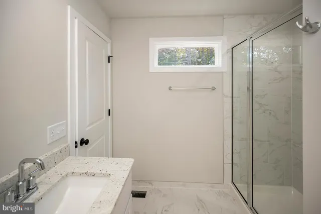 a kitchen with cabinets stainless steel appliances and a counter space