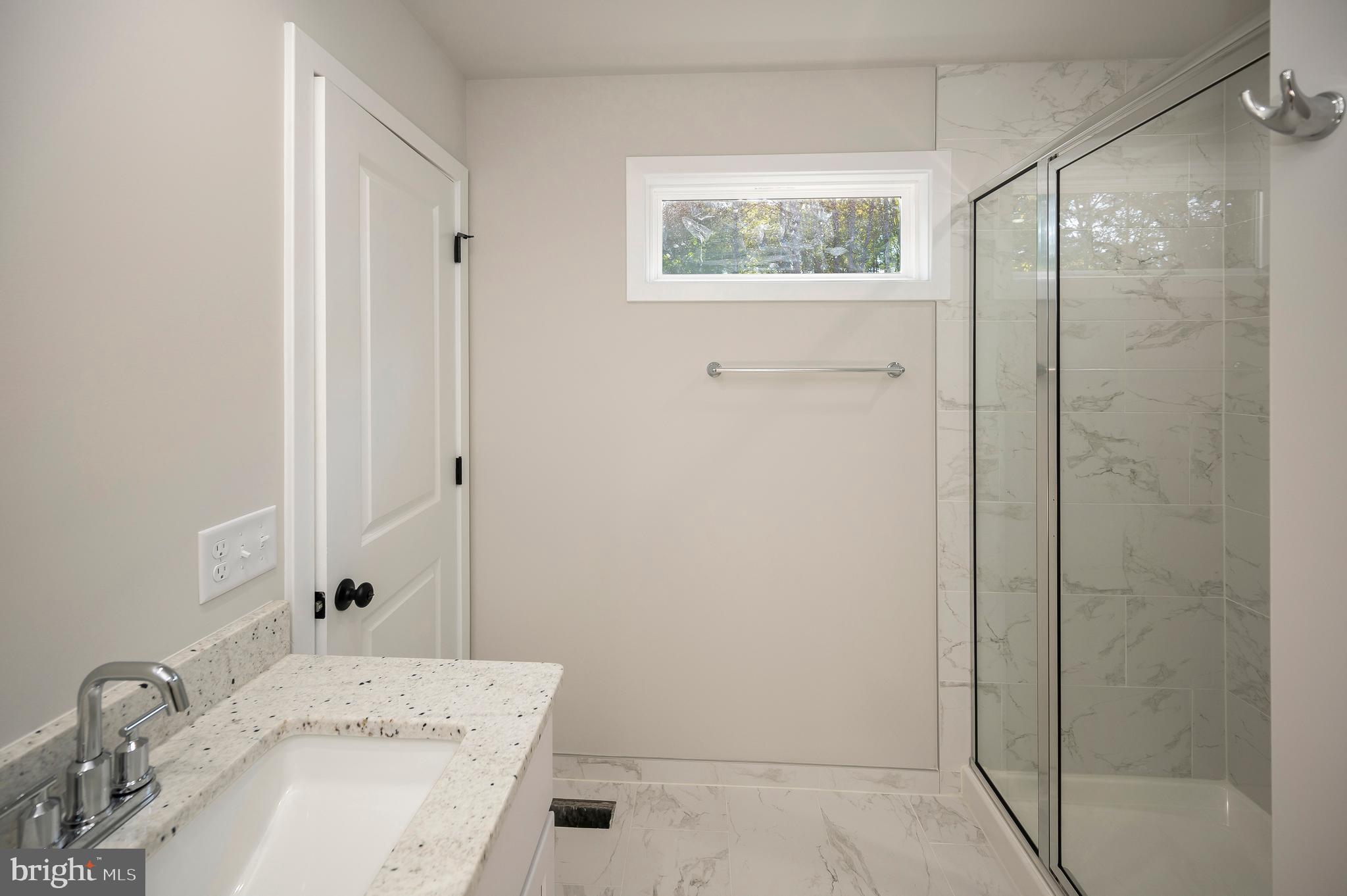 3145 Lewiston Road Bumpass, VA 23024 - Photo 10 of 44 a bathroom with a sink and a mirror