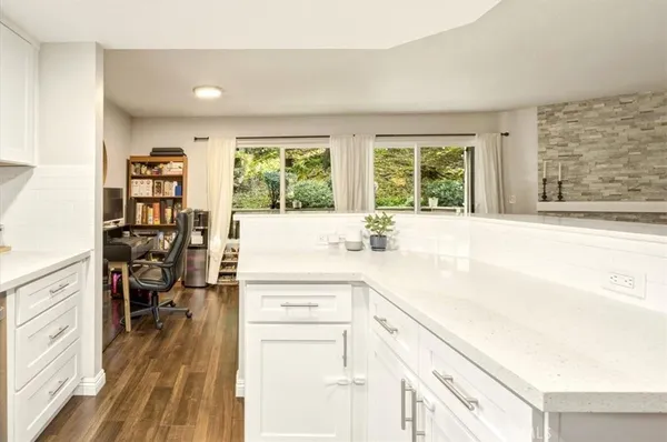 a kitchen with a sink and cabinets