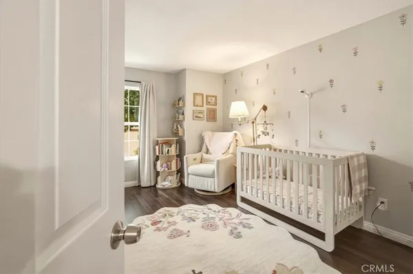 a bedroom with a white bed and white walls