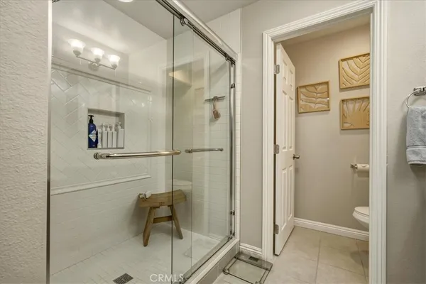 a bathroom with a shower and a sink