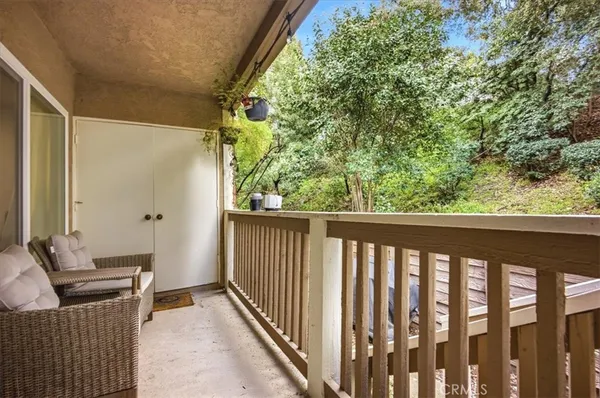 a view of a balcony with furniture