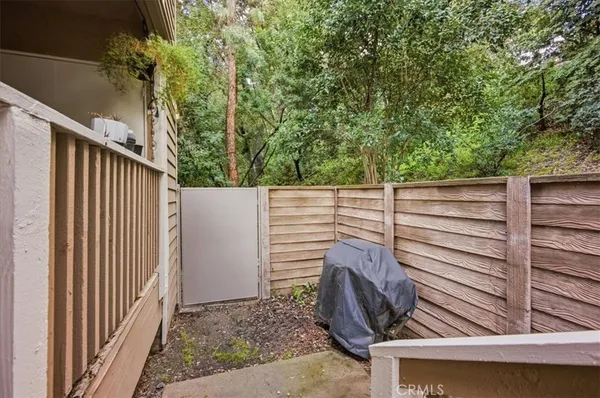a view of a balcony with furniture