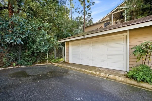 a view of white house with a yard