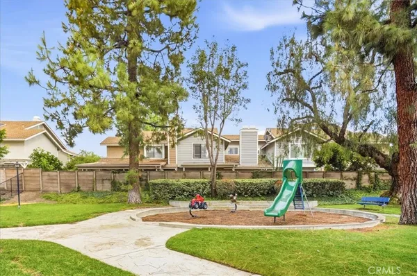 a view of a house with swimming pool and sitting area