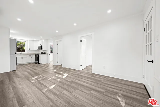 a view of a living room with a large window