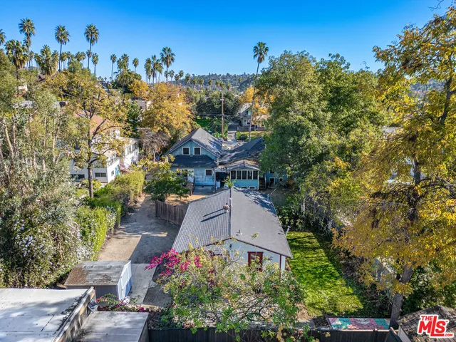an aerial view of houses with outdoor space