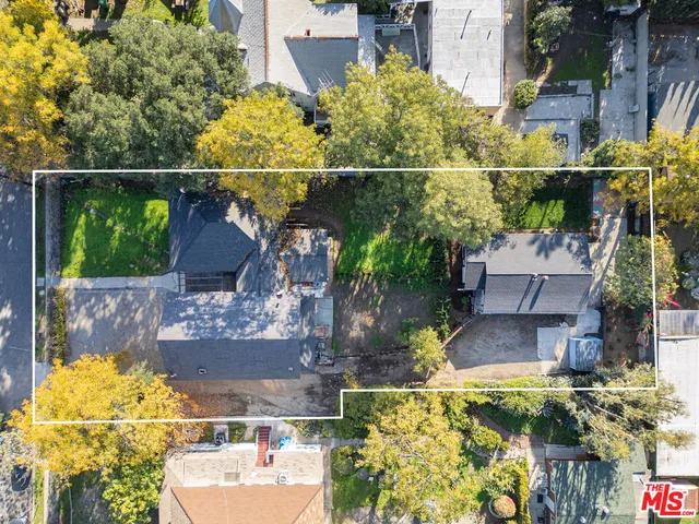 an aerial view of residential building and parking space