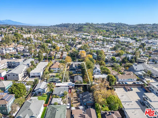 an aerial view of residential building with parking space