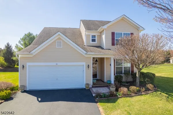 a front view of a house with yard