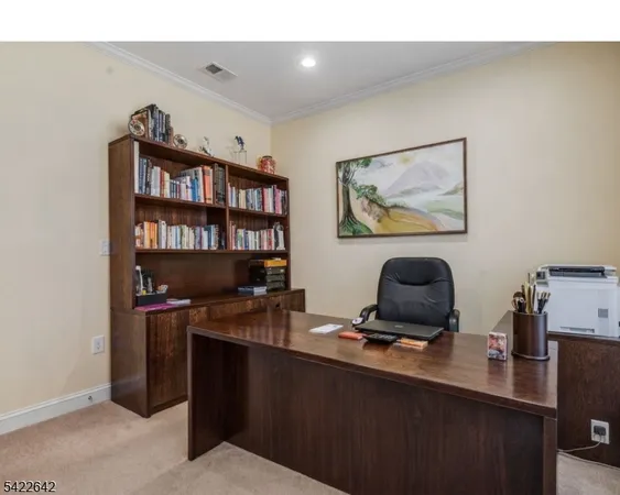a view of a workspace with furniture