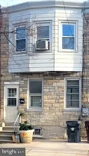 a front view of a house with parking