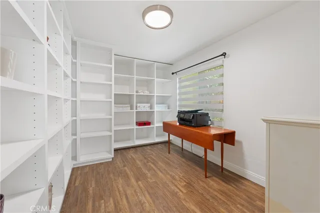 a room with furniture and a wooden floor