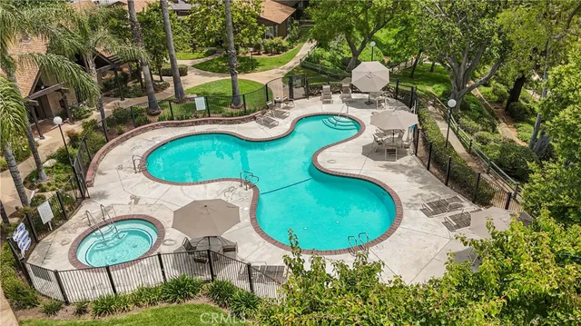 an aerial view of a swimming pool and outdoor space