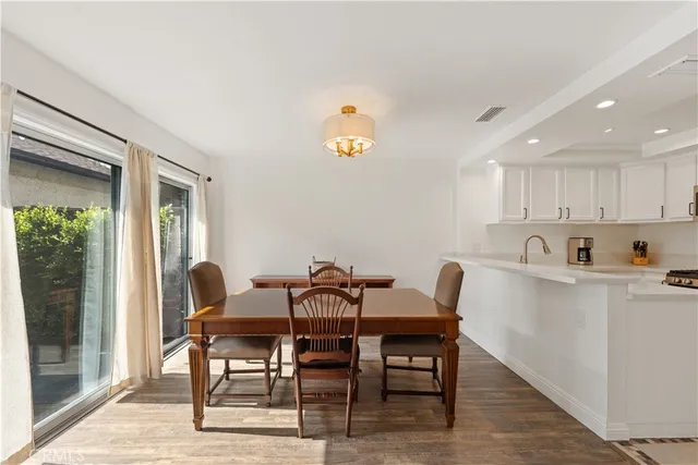 a view of a dining room with furniture and window