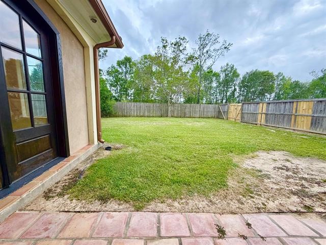 12410 Keith Road Beaumont, TX 77713 - Photo 43 of 45 a view of a backyard with a garden